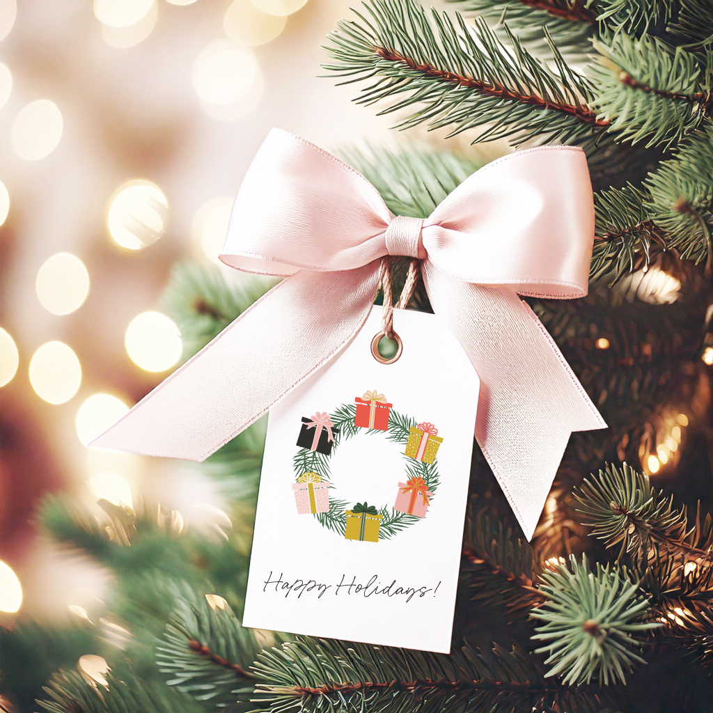 Image of a gift tag featuring an original hand drawn wreath decorated with gift boxes. The design is part of Christmas 2024 great giveaway!
