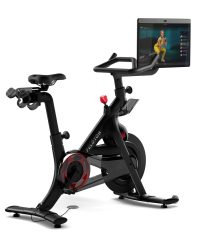 An image of a Peloton exercise bike with integral monitor screen.