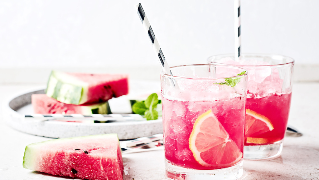 An image featuring two glasses containing mint and watermelon mock tails.