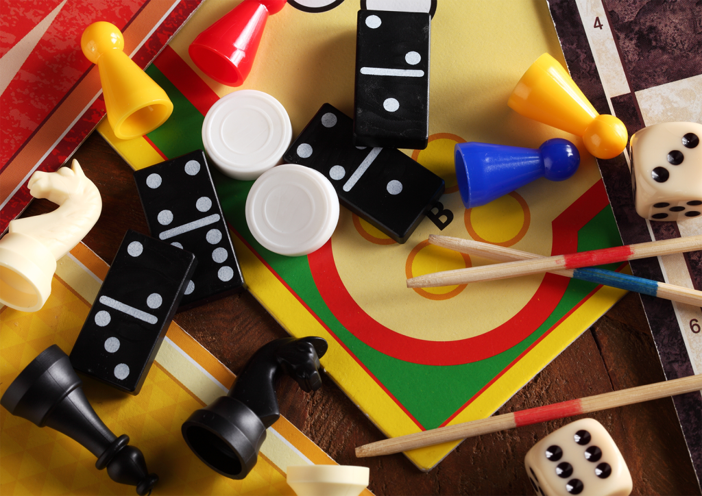 An image showing various pieces from popular family board games.