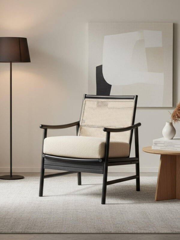 Black cane wicker armchair with boucle cushion styled in modern house interior