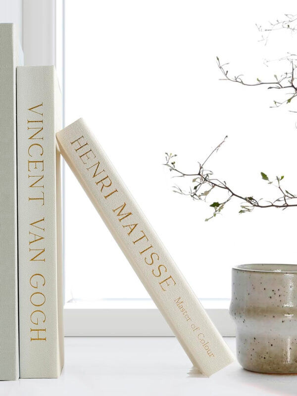 Set of three decorative faux books.