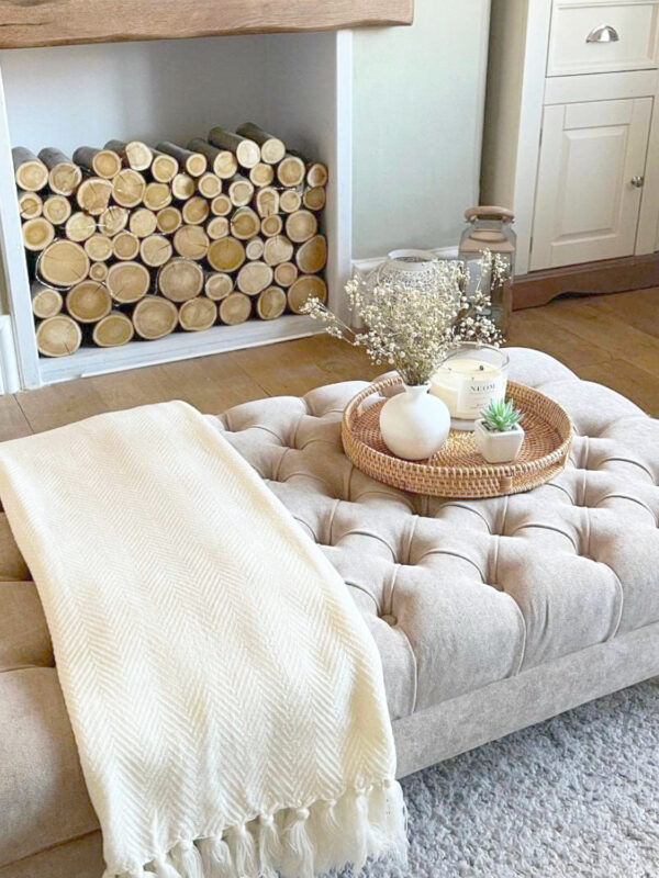 Chesterfield footstool coffee table in Naples fabric with deep buttoned upholstery in an English country house living room