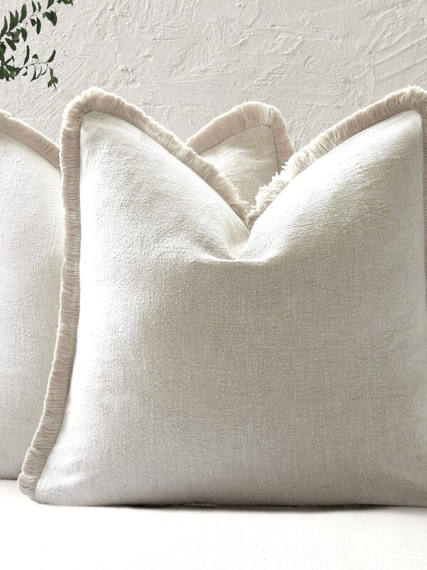 Neutral fringed cushion covers set of 2 in ramie cotton blend with tailored fringe border.