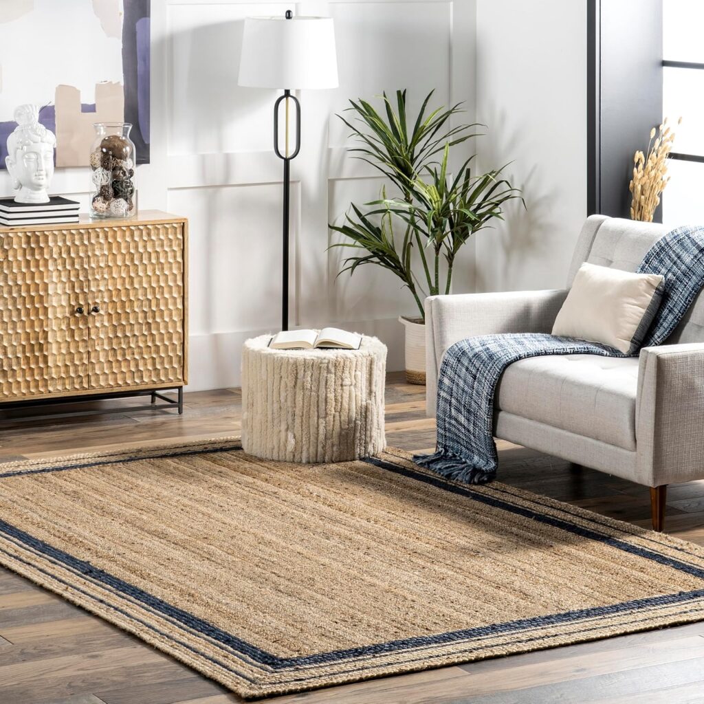 An image of a living room setting featuring the Braided Jute Rug. Available to buy from Amazon