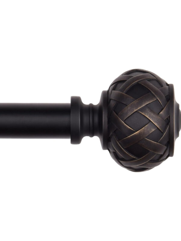 Black curtain rod with decorative lattice finial detail