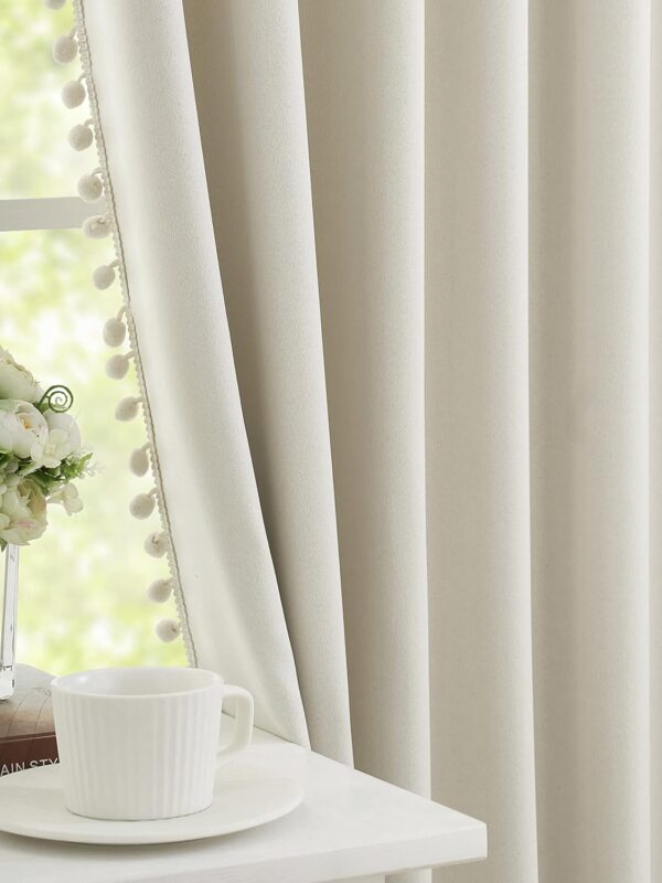 An alternative image of the mid-section of the Pom Pom Ivory Blackout Curtains. Available to buy from Amazon.